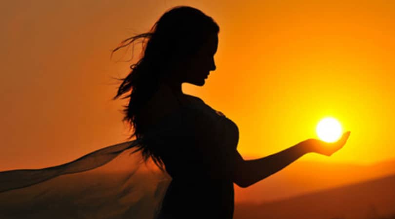 The magic of Litha - Summer Solstice, woman holding the sun